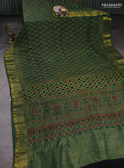 Dola silk saree green with allover floral butta prints and zari woven border