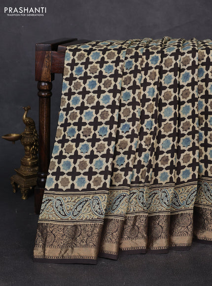 Dola silk saree black with allover floral butta prints and zari woven border