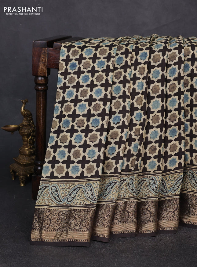 Dola silk saree black with allover floral butta prints and zari woven border