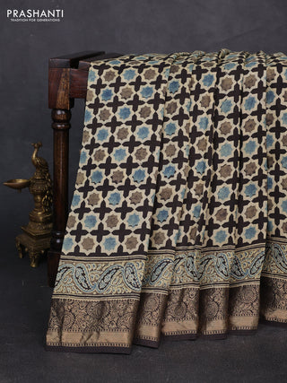 Dola silk saree black with allover floral butta prints and zari woven border