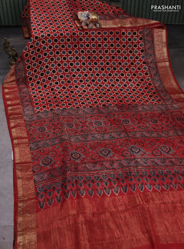 Dola silk saree maroon with allover floral butta prints and zari woven border