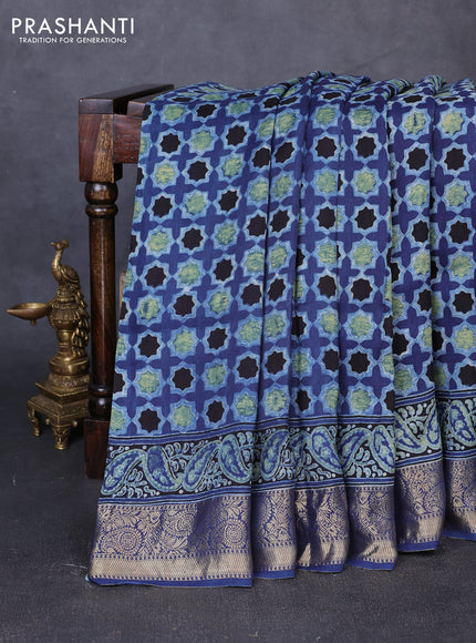Dola silk saree indigo blue with allover floral butta prints and zari woven border