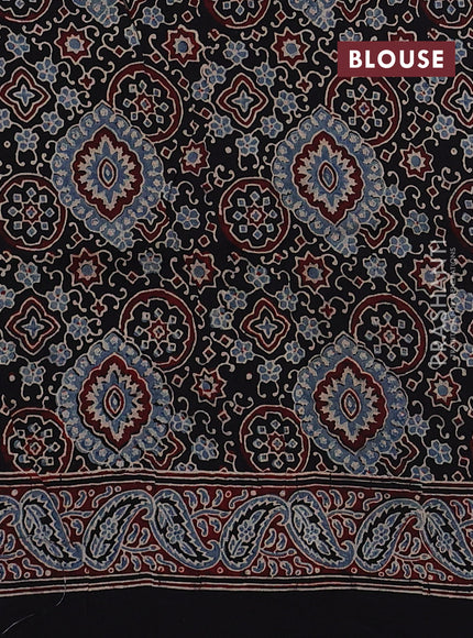 Dola silk saree black with allover floral butta prints and zari woven border