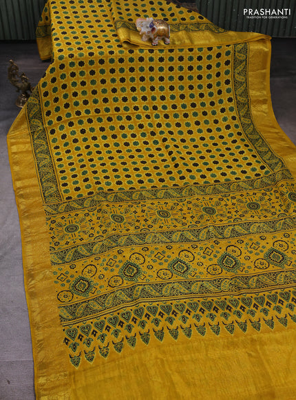 Dola silk saree yellow with allover floral butta prints and zari woven border
