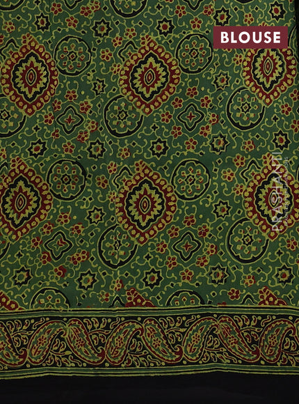 Dola silk saree green shade with allover floral butta prints and zari woven border