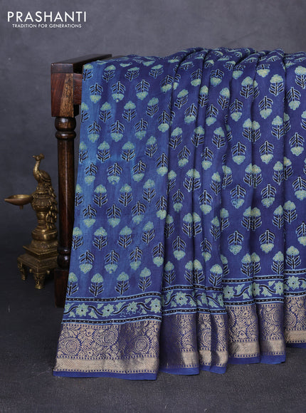 Dola silk saree indigo blue with allover floral butta prints and zari woven border