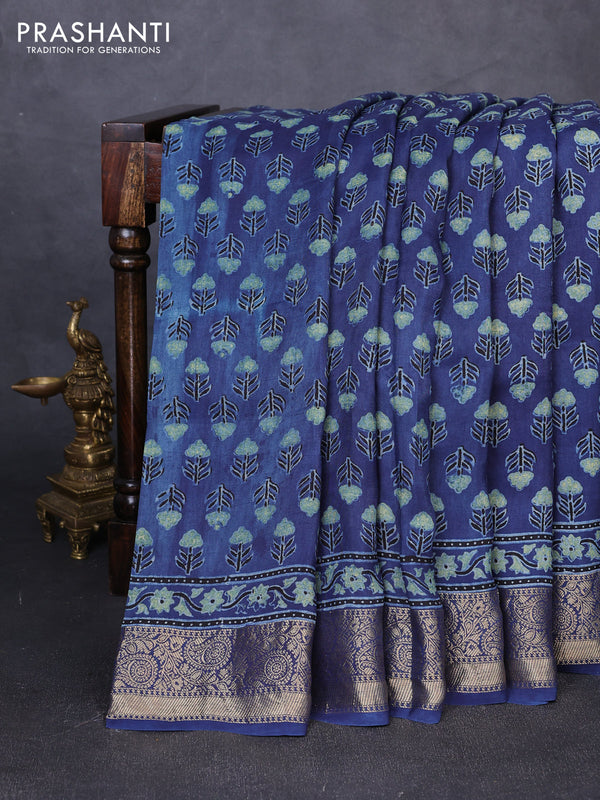 Dola silk saree indigo blue with allover floral butta prints and zari woven border