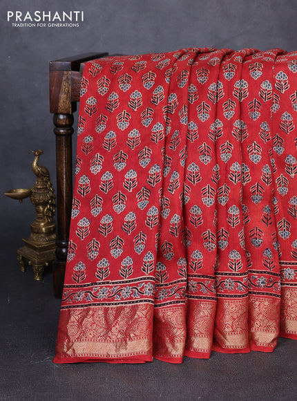 Dola silk saree maroon with allover floral butta prints and zari woven border