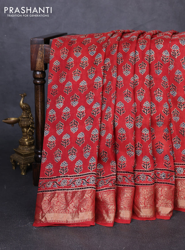 Dola silk saree maroon with allover floral butta prints and zari woven border