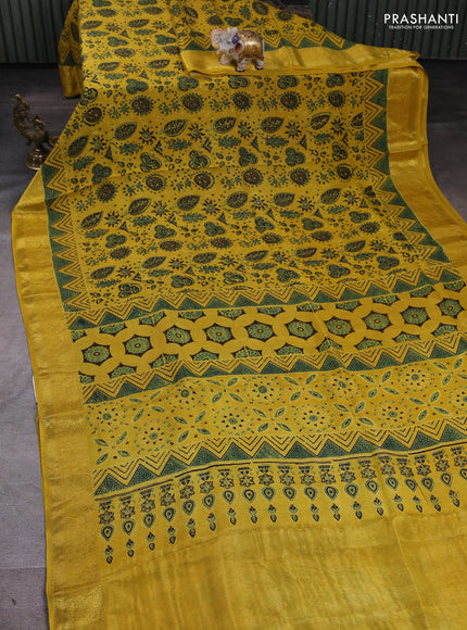 Dola silk saree yellow with allover ajrakh prints and zari woven border