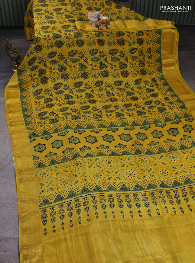 Dola silk saree yellow with allover ajrakh prints and zari woven border