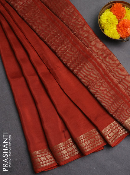 Semi mysore silk saree rust shade with plain body and zari woven border