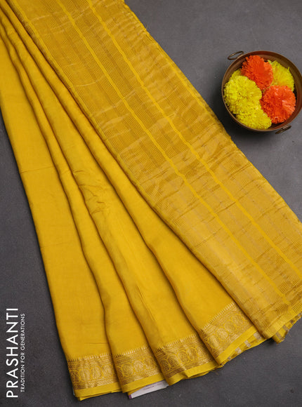 Semi mysore silk saree yellow with plain body and temple design zari woven border