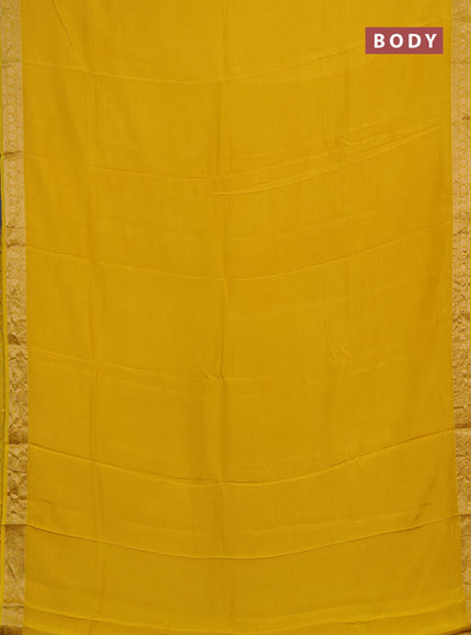Semi mysore silk saree yellow with plain body and temple design zari woven border
