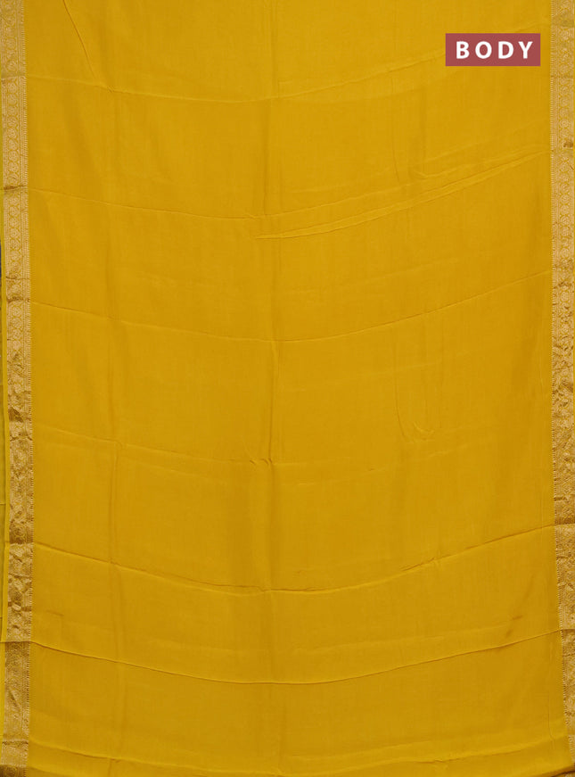Semi mysore silk saree yellow with plain body and temple design zari woven border