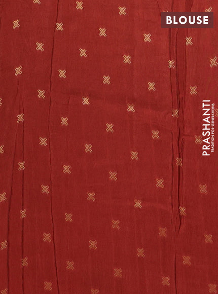 Semi mysore silk saree rust shade with plain body and temple design zari woven border