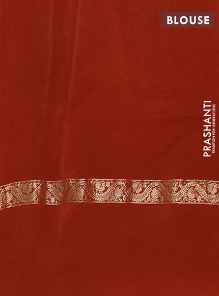 Semi mysore silk saree rust shade with plain body and zari woven simple border