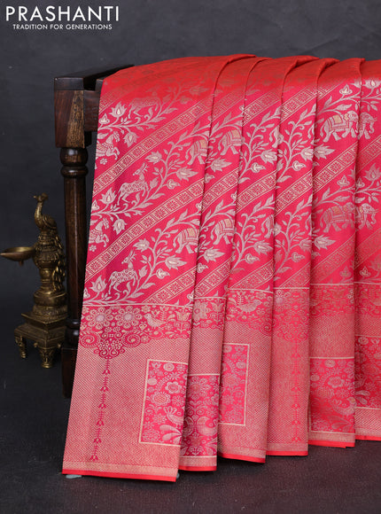 Pure kanchipuram silk saree dual shade of pinkish orange with allover zari woven brocade weaves and long zari woven border