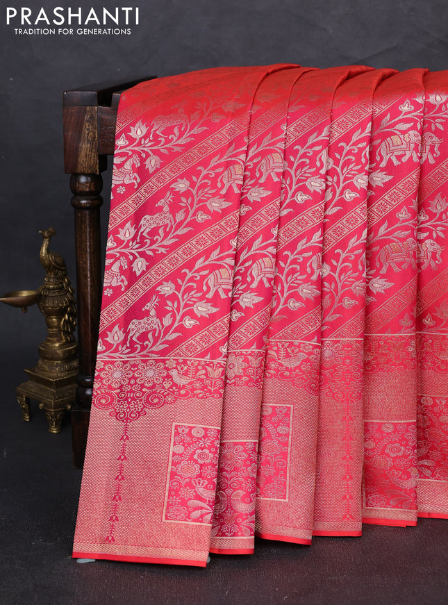 Pure kanchipuram silk saree dual shade of pinkish orange with allover zari woven brocade weaves and long zari woven border