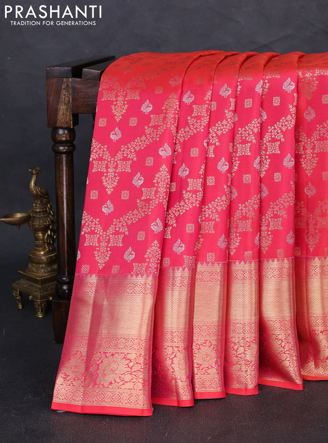 Pure kanchipuram silk saree dual shade of pinkish orange with allover zari woven brocade weaves and long zari woven border