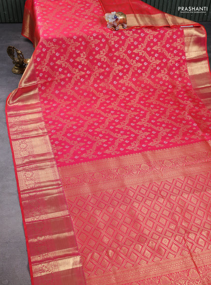 Pure kanchipuram silk saree dual shade of pinkish orange with allover zari woven brocade weaves and long zari woven border