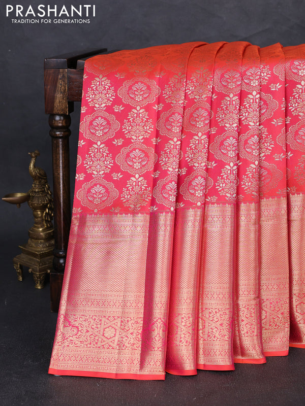 Pure kanchipuram silk saree dual shade of pinkish orange with allover zari woven brocade weaves and long zari woven border