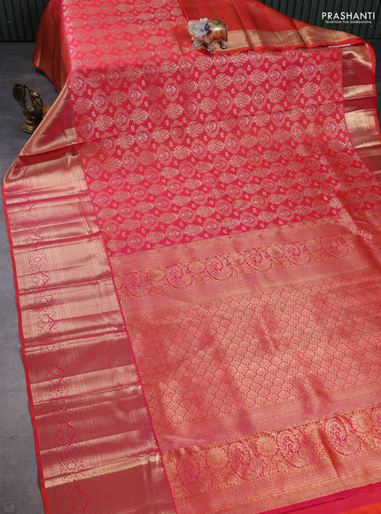 Pure kanchipuram silk saree dual shade of pinkish orange with allover zari woven brocade weaves and long zari woven border