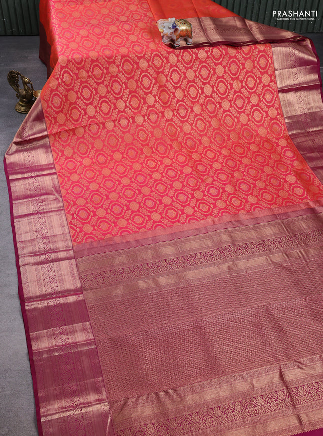 Pure kanchipuram silk saree dual shade pinkish orange and wine shade with allover zari woven brocade weaves and long zari woven border