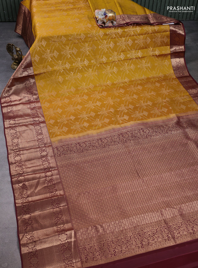 Pure kanchipuram silk saree mustard green and deep maroon with allover zari woven brocade weaves and long zari woven border