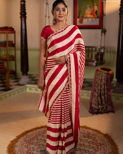 Crepe silk saree cream and pink with allover stripe pattern and mirror embroidery pallu