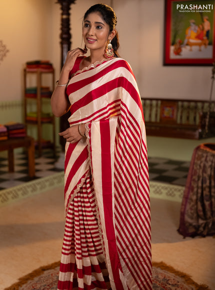 Crepe silk saree cream and pink with allover stripe pattern and mirror embroidery pallu