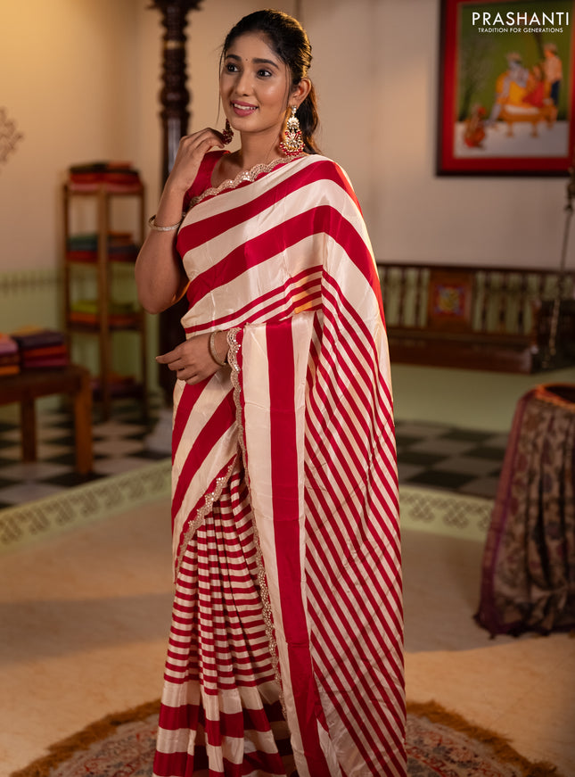 Crepe silk saree cream and pink with allover stripe pattern and mirror embroidery pallu