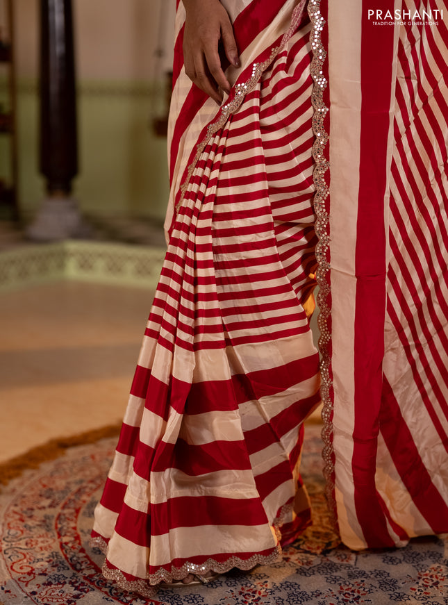 Crepe silk saree cream and pink with allover stripe pattern and mirror embroidery pallu