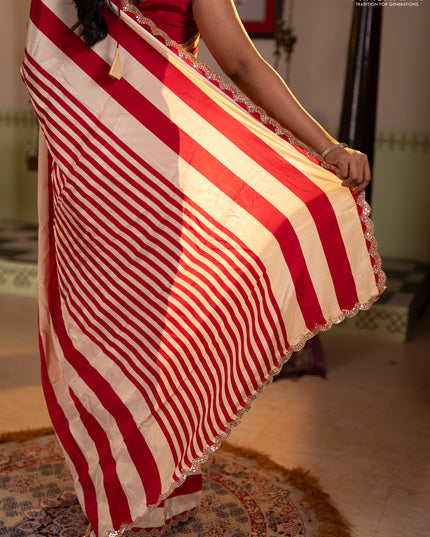 Crepe silk saree cream and pink with allover stripe pattern and mirror embroidery pallu