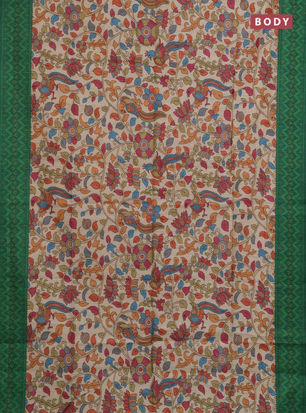 Semi tussar saree beige and green with allover kalamkari prints and patola printed border