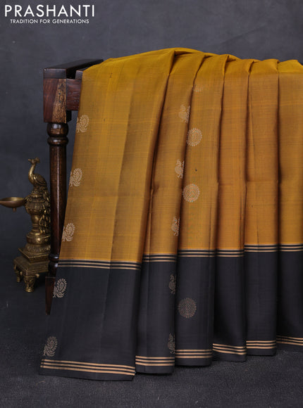 Pure soft silk saree mustard green and black with allover zari woven buttas and rettapet zari woven butta border