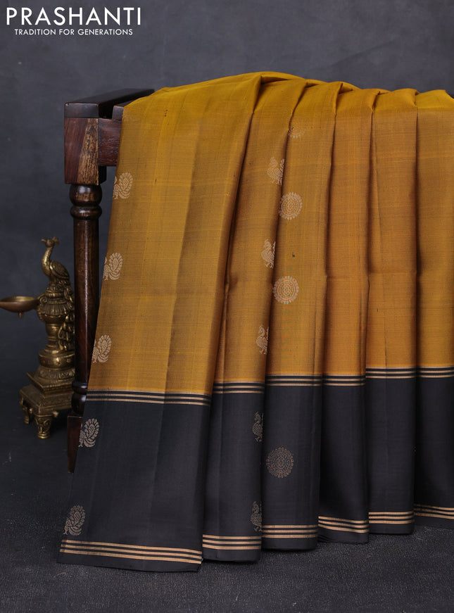 Pure soft silk saree mustard green and black with allover zari woven buttas and rettapet zari woven butta border
