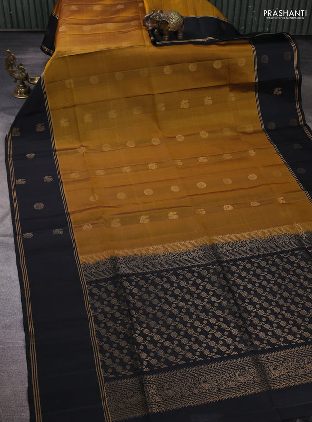 Pure soft silk saree mustard green and black with allover zari woven buttas and rettapet zari woven butta border