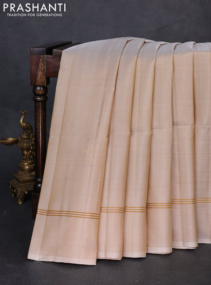Pure soft silk saree beige and magenta pink with allover zari woven buttas and rettapet zari woven border