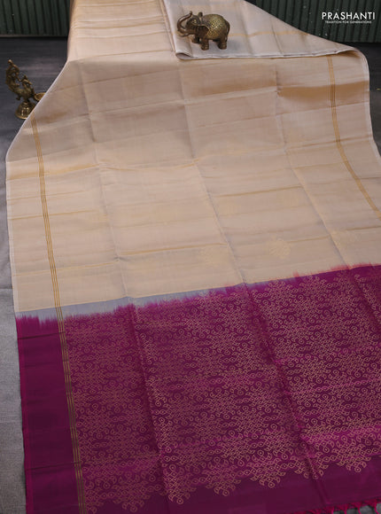 Pure soft silk saree beige and magenta pink with allover zari woven buttas and rettapet zari woven border
