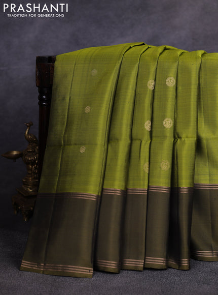 Pure soft silk saree light green and olive green with allover zari woven buttas and rettapet zari woven border