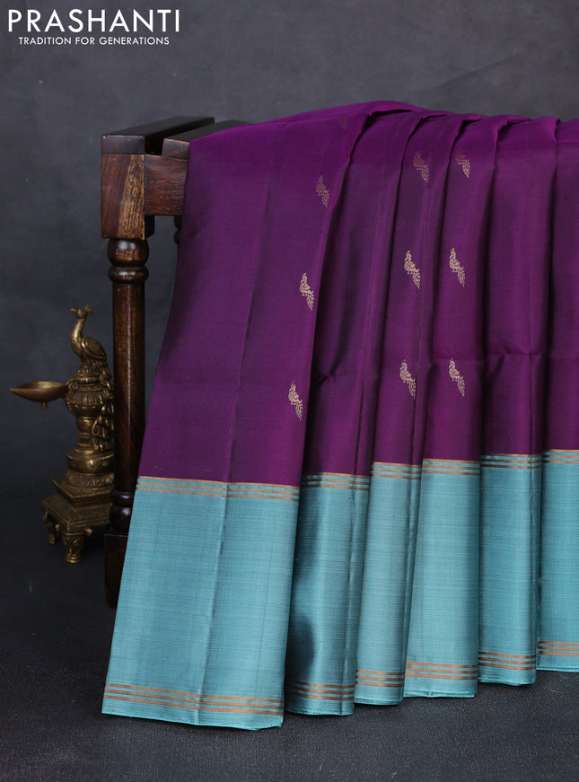 Pure soft silk saree deep purple and teal blue with allover zari woven buttas and rettapet zari woven border