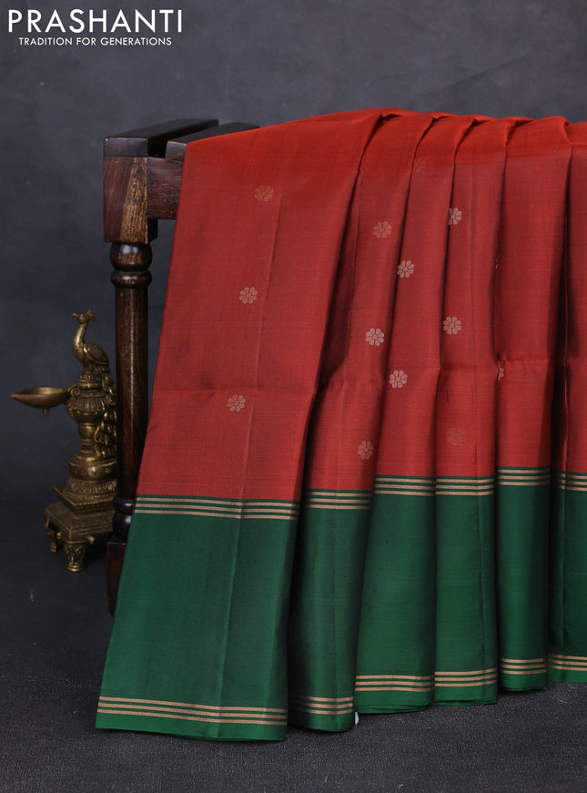 Pure soft silk saree rust shade and bottle green with allover zari woven buttas and rettapet zari woven border