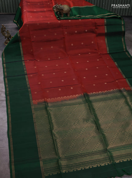 Pure soft silk saree rust shade and bottle green with allover zari woven buttas and rettapet zari woven border