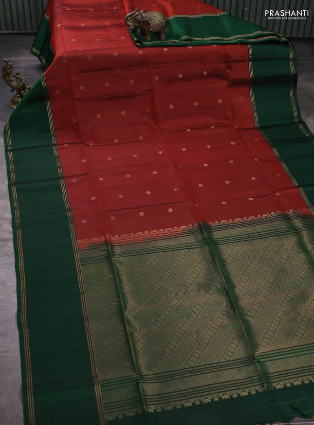 Pure soft silk saree rust shade and bottle green with allover zari woven buttas and rettapet zari woven border