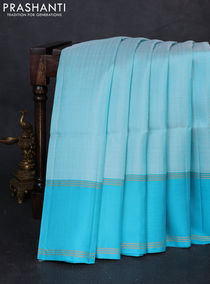 Pure soft silk saree light blue and teal blue with allover zari woven buttas and rettapet zari woven border