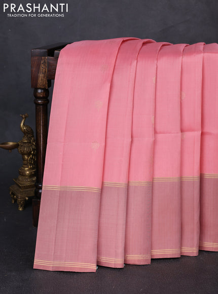 Pure soft silk saree peach shade and pastel peach with allover zari woven buttas and rettapet zari woven border