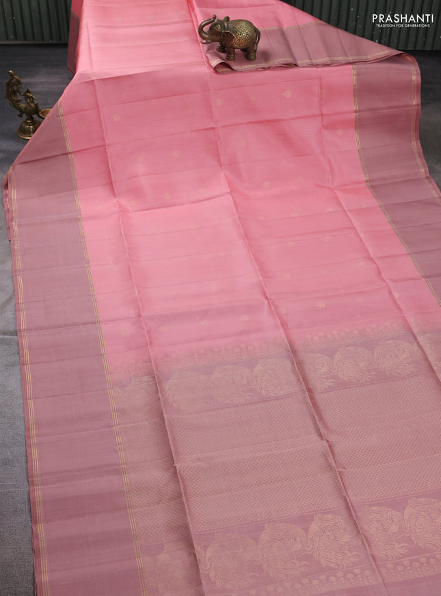 Pure soft silk saree peach shade and pastel peach with allover zari woven buttas and rettapet zari woven border