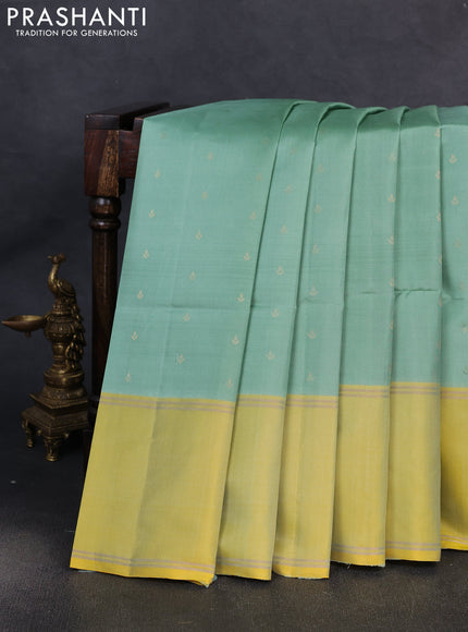 Pure soft silk saree pastel green and yellow with allover zari woven buttas and rettapet zari woven border