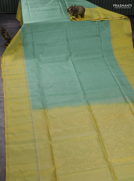 Pure soft silk saree pastel green and yellow with allover zari woven buttas and rettapet zari woven border